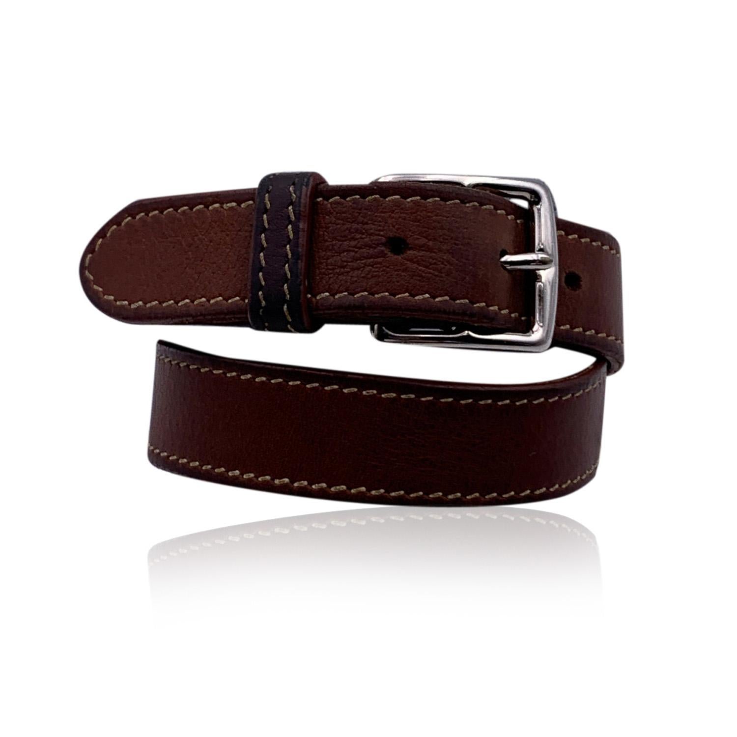 Hermes leather adjustable Etriviere bracelet in brown color. Palladium buckle. 3 holes adjustment. For wrists up to 7 inches - 17.8 in circumference. Total length of the strap: 17.5 inches - 44.5 cm. Signed 'Hermes Paris - Made in France' on the