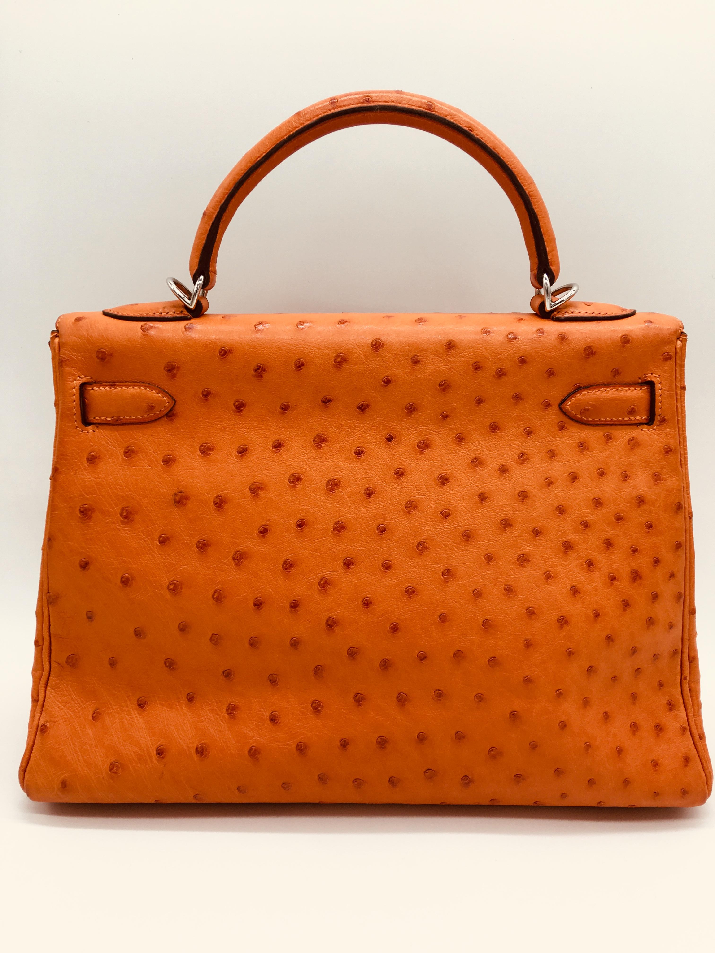 Tangerine is a gorgeous colour for winter and summer alike – a really bright jewel like orange which is especially lovely on this Kelly 32 in Ostrich with Palladium Hardware. On close inspection there are a few marks on the front of the bag and at