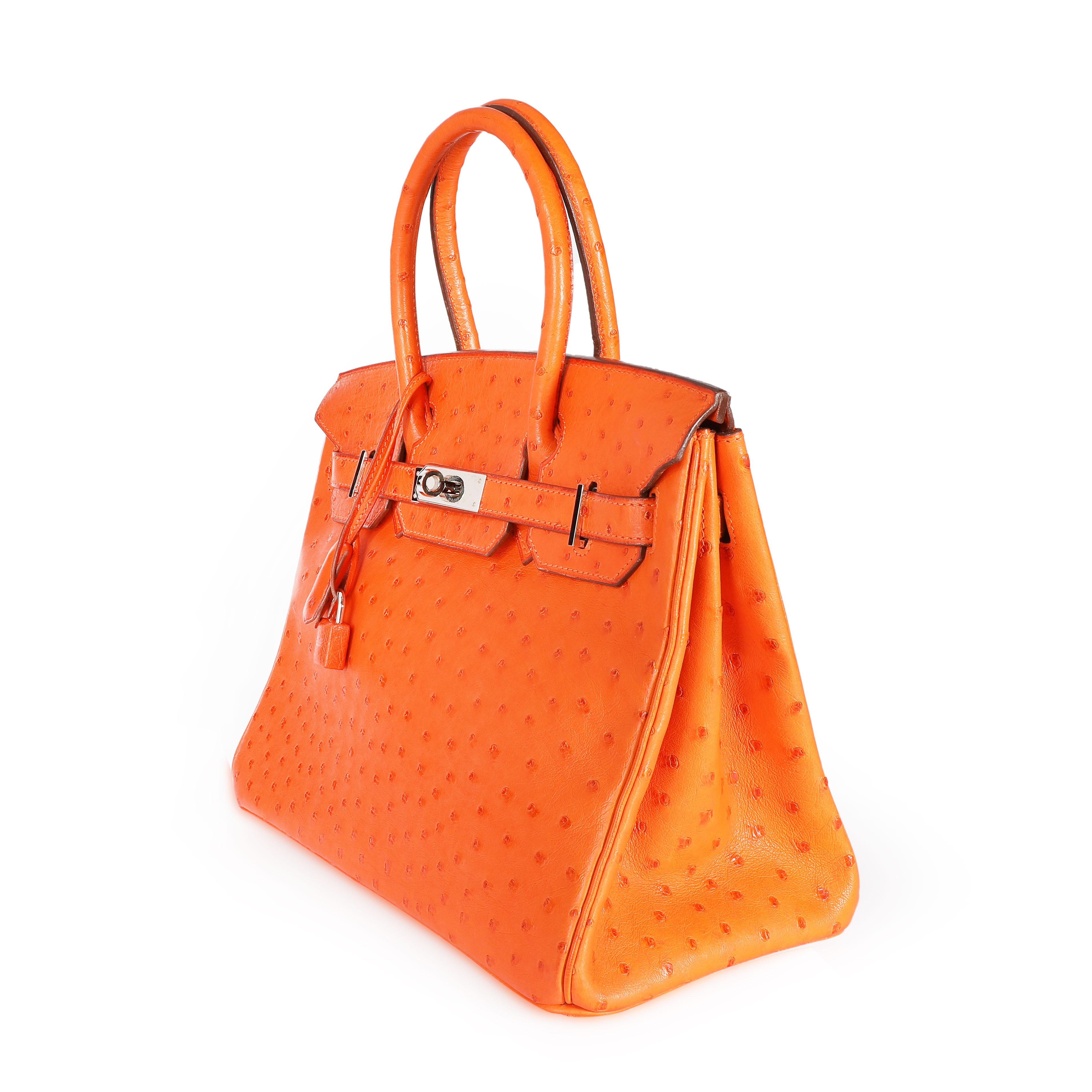 Listing Title: Hermès Tangerine Ostrich Birkin 30 PHW
SKU: 108497

Condition Description: The holy grail of handbags: the Hermès Birkin. First introduced in 1984, the Birkin is crafted entirely by hand over the course of 18 hours. Highly covetable