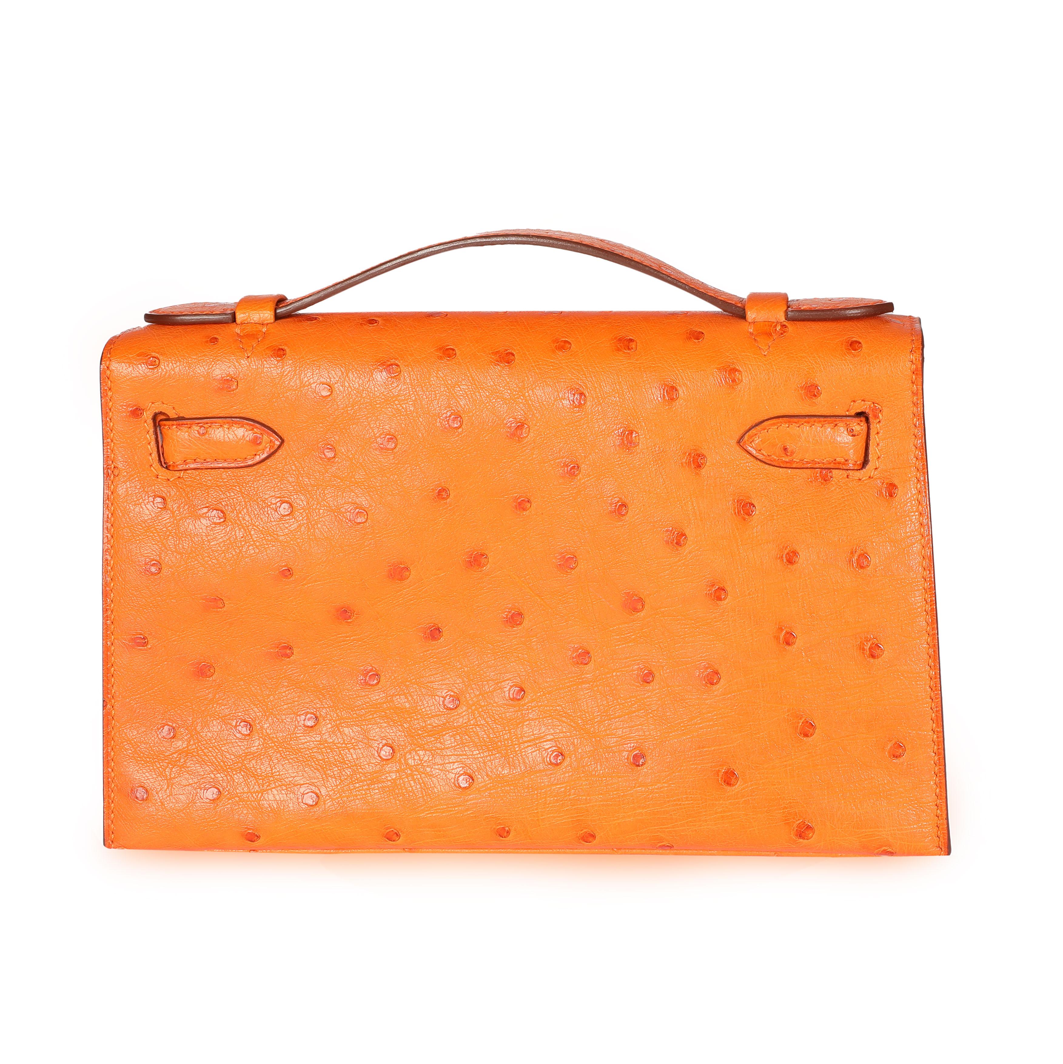 Listing Title: Hermès Tangerine Ostrich Kelly Pochette PHW
SKU: 108501

The handheld version of the Kelly is crafted in Tangerine Ostrich and features Palladium hardware.

Handbag Condition: Very Good
Condition Comments: Very Good Condition. Plastic