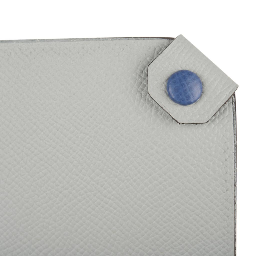 Hermes offers an Hermes Tarmac Passport Holder with bi color feature.
Blue Glacier Epsom leather with Blue Brighton snap. 
Spoil yourself, or gift this luxury touch for travel.  
Comes with the signature Hermes box and ribbon.
Please additional