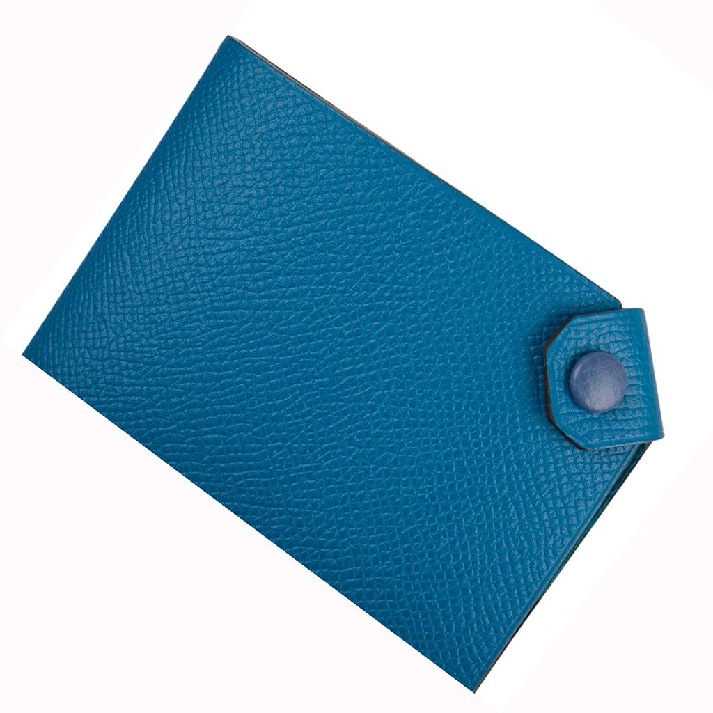 Guaranteed authentic Hermes Tarmac Passport Holder with bi color feature.
Blue Izmir epsom leather with Blue Brighton snap.
Spoil yourself, or gift this luxury touch for travel.  
Comes with the signature Hermes box and ribbon.
Please additional