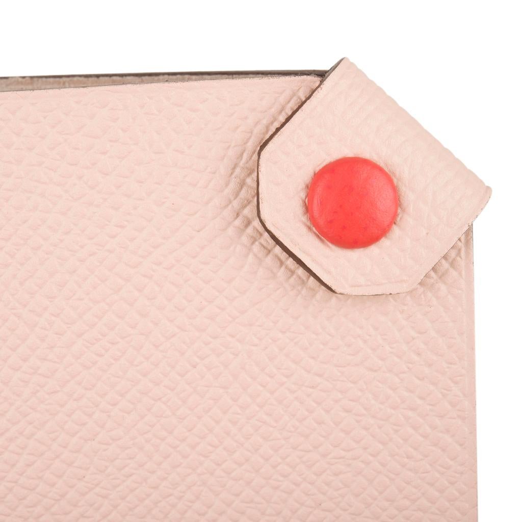 Guaranteed authentic Hermes Tarmac Passport Holder with bi color feature.
Rose Eglantine epsom leather with Rose Jaipur snap.   
Spoil yourself, or gift this luxury touch for travel.  
Comes with the signature Hermes box and ribbon.
Please