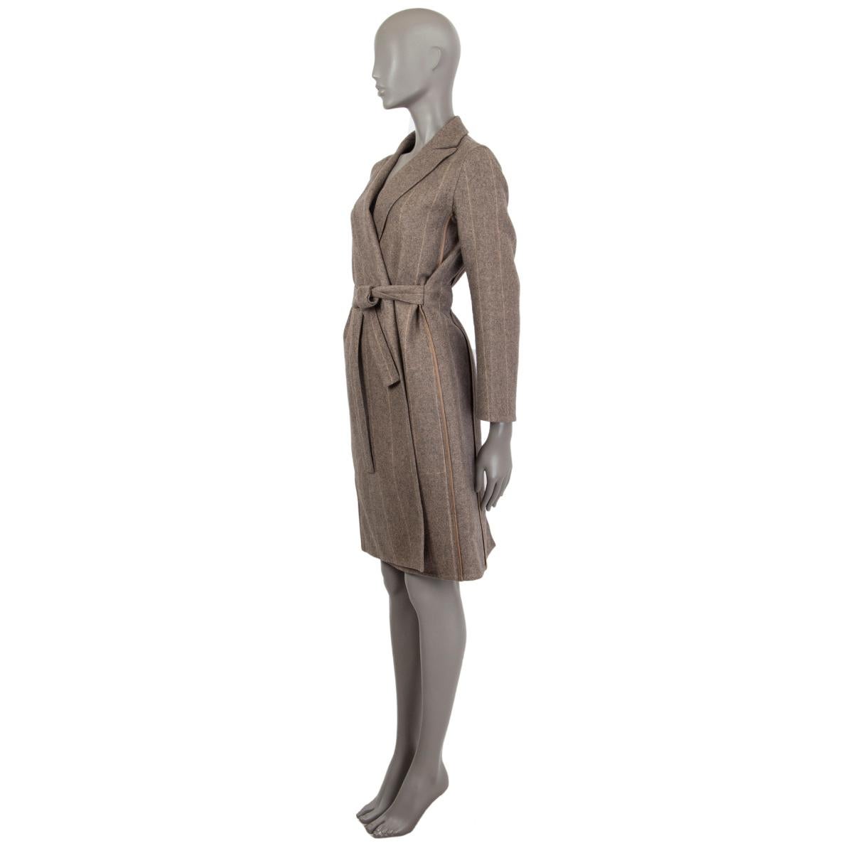 Hermès pin stripe coat in taupe and beige cashmere (100%) with a peak lapel. Has a matching tie around belt. Closes on the front with a hidden inner button. Unlined. Has been worn and is in excellent condition. 

Tag Size 34
Size XXS
Shoulder Width