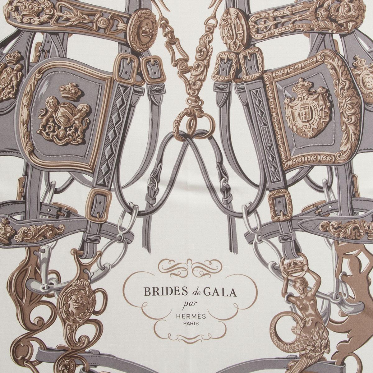 100% authentic Hermes 'Brides de Gala 90 Fluid' by Hugo Grygkar in taupe and off-white silk jersey (100%) with details in grey and antique gold. Has been worn and is in excellent condition.

Brides de Gala! One of the most iconic Hermès designs. In