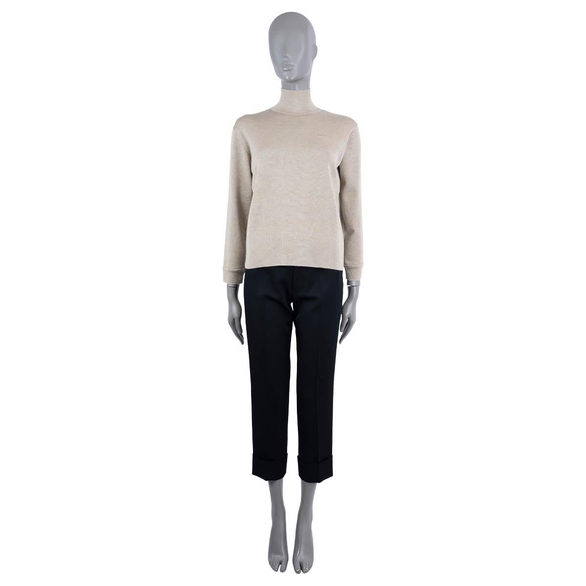 100% authentic Hermès mock neck sweater in taupe cashmere (50%) and silk (50%). Features embroidered logo at the chest. Has been worn and is in excellent condition.

2020 Pre-Fall

Measurements
Tag Size 36
Size XS
Shoulder Width	41cm (16in)
Bust
