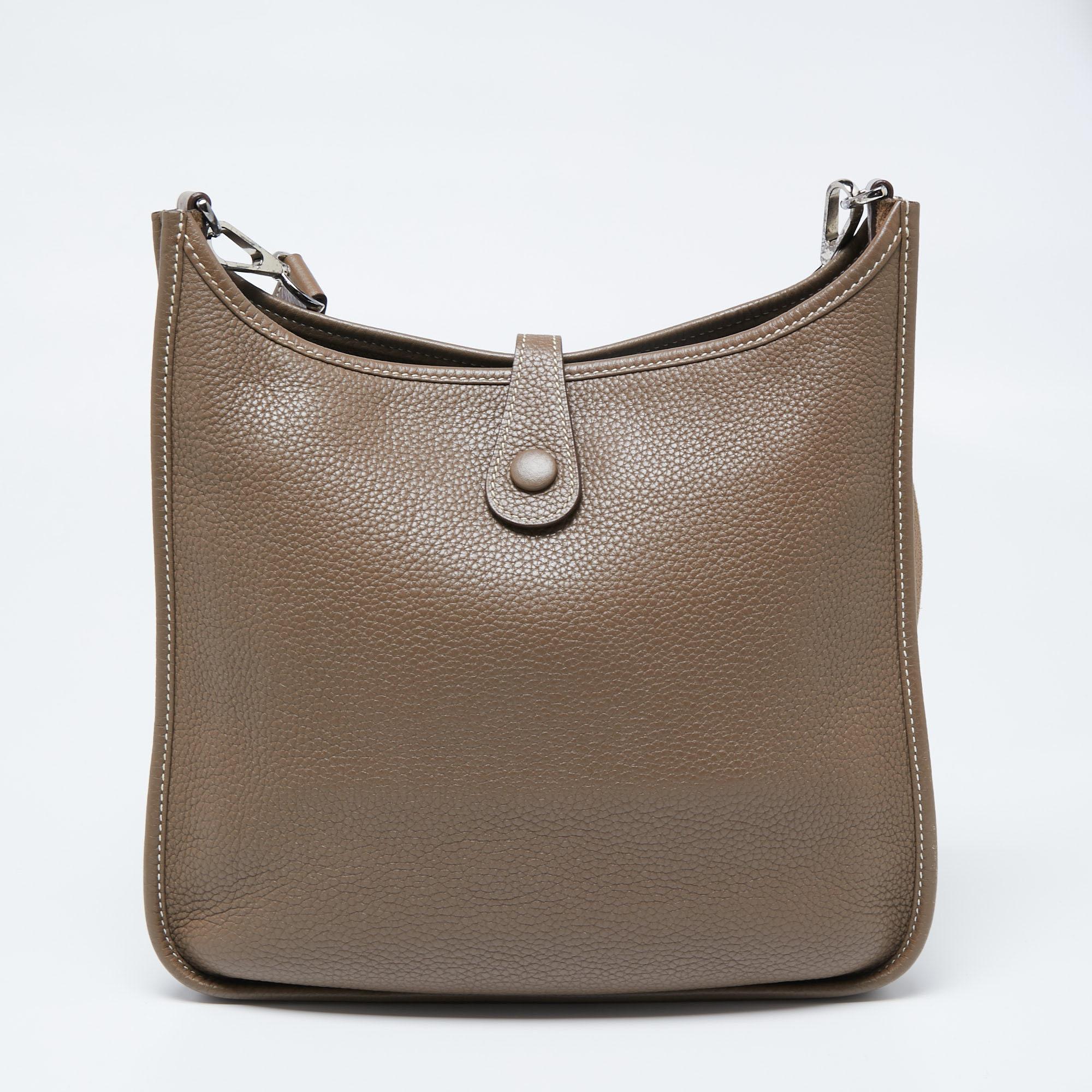 The Evelyne is another investment-worthy bag from Hermès. This one here is the Evelyne I PM crafted from Clemence leather and detailed with the signature elements of the leather tab closure, the saddle-like shape, and the perforated H on the front.