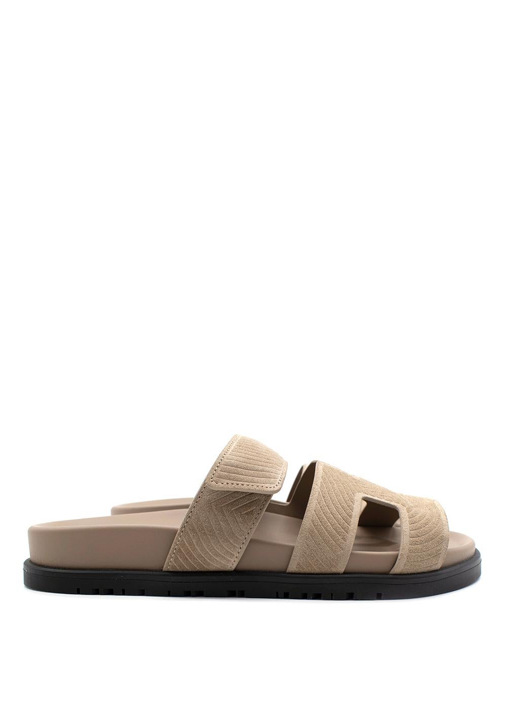 Hermes Taupe Goatskin Suede Chypre Sandals

- Iconic Chypre sandal rendered in soft suede in a warm taupe hue
- H' cut-out leather strap and adjustable velcro strap
- Deep suede-lined footbed
- Rubber sole with H embossed