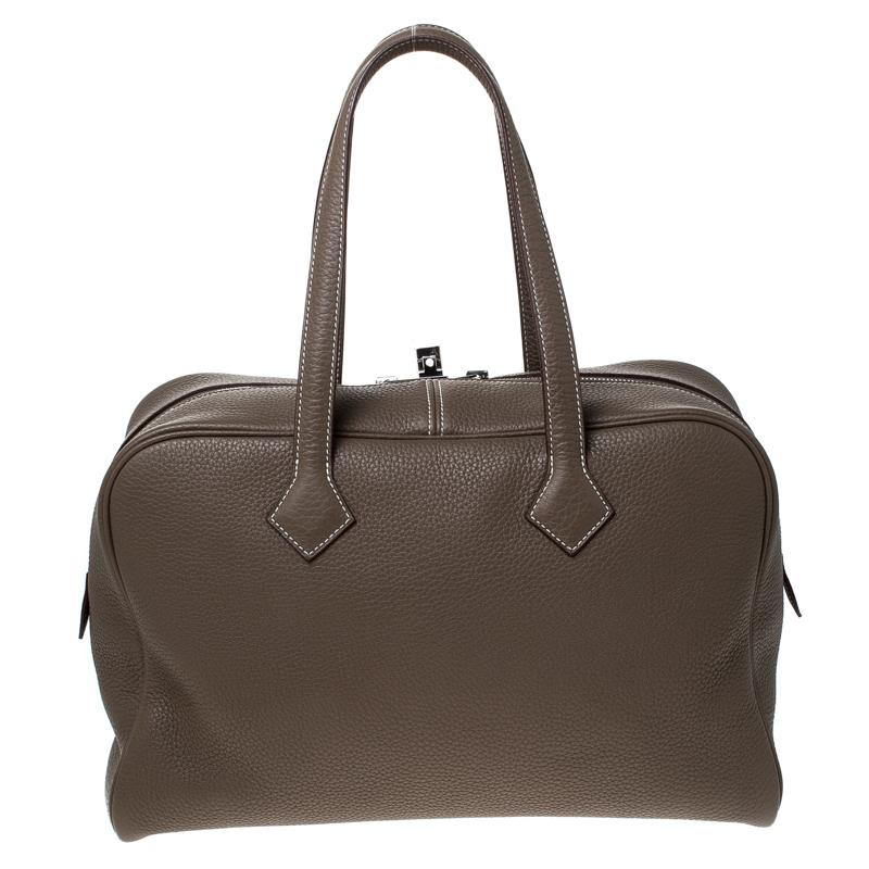 Bags as well-crafted as this one from Hermes don't cross our paths often because they are exclusive. The Victoria II comes wonderfully crafted from Clemence leather and designed with double zippers that can be secured by a flip-lock. It carries an