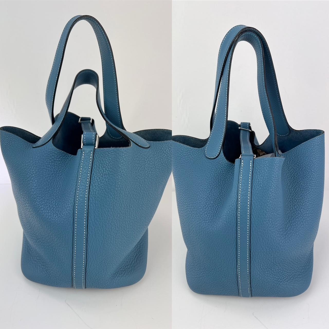 Pre-Owned  100% Authentic
Hermes Taurillon Clemence Picotin 22 MM Blue Leather Hand Bag 
This chic tote is crafted of textured clemence calfskin leather in blue. 
This bucket style bag features a unique one piece reinforced design 
with leather top