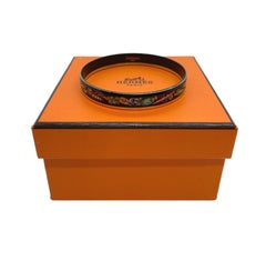 Pulsera brazalete estrecha Hermès Tchotchke esmaltada y dorada