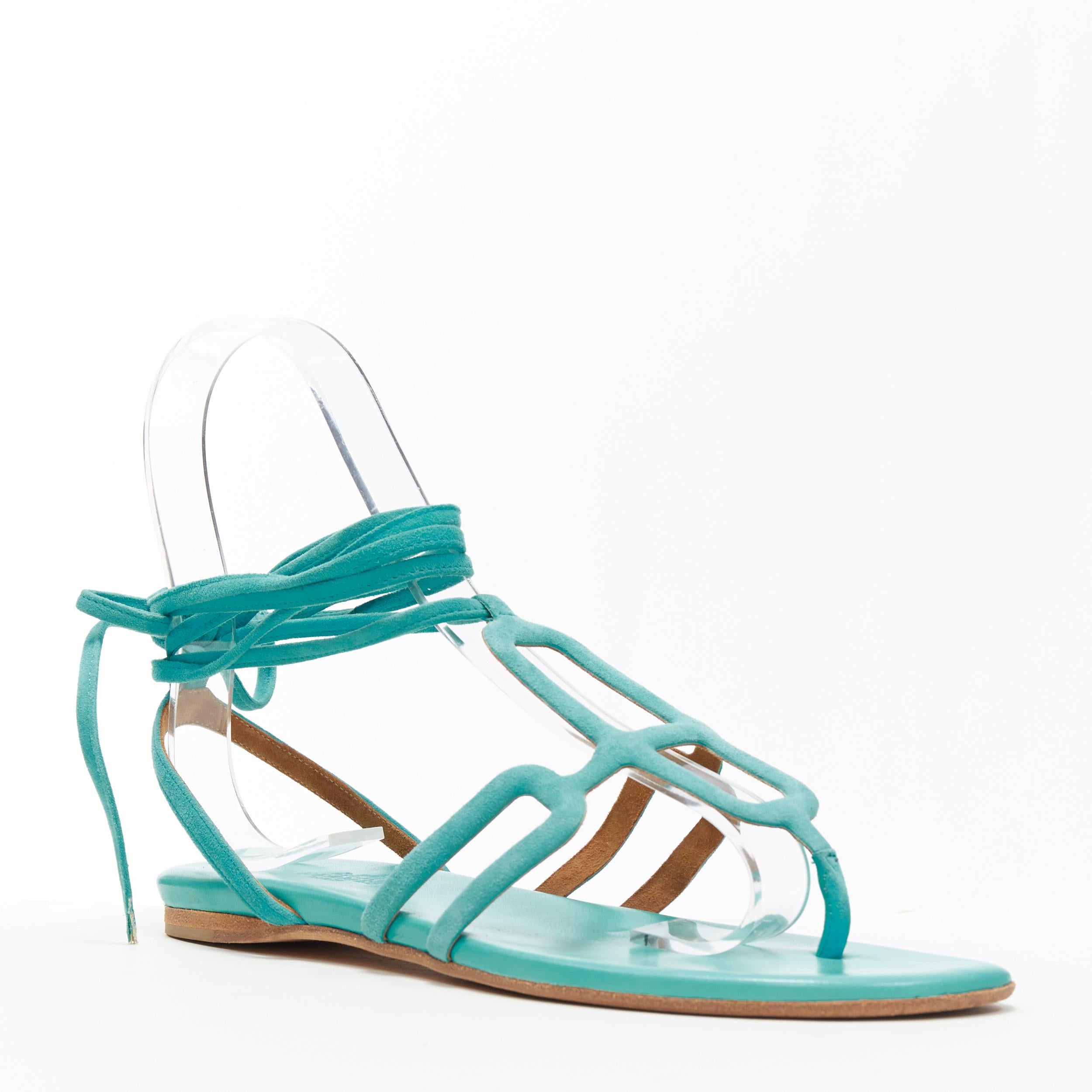 HERMES teal blue suede geometric buckle ankle wrap thong flat sandals EU35.5
Brand: Hermes
Model Name / Style: Suede sandals
Material: Suede
Color: Blue
Pattern: Solid
Closure: Ankle strap
Extra Detail: Buckle design. Thong sandals Flat (Under 1 in)