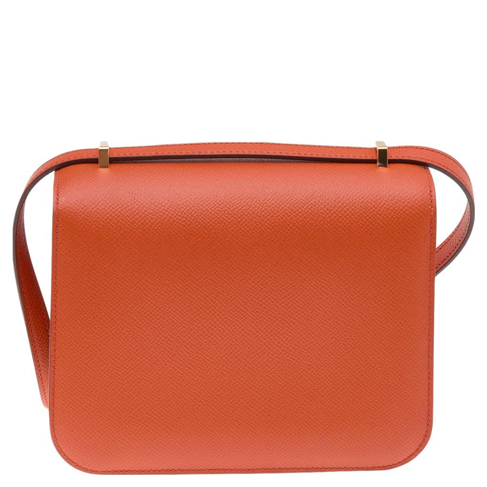 This elegant bag was named after the newborn daughter of Hermés' designer, Catherine Chaillet, and was created in 1969. The creation is handcrafted in leather in an orange hue and features the iconic H clasp on the front flap made from gold-tone