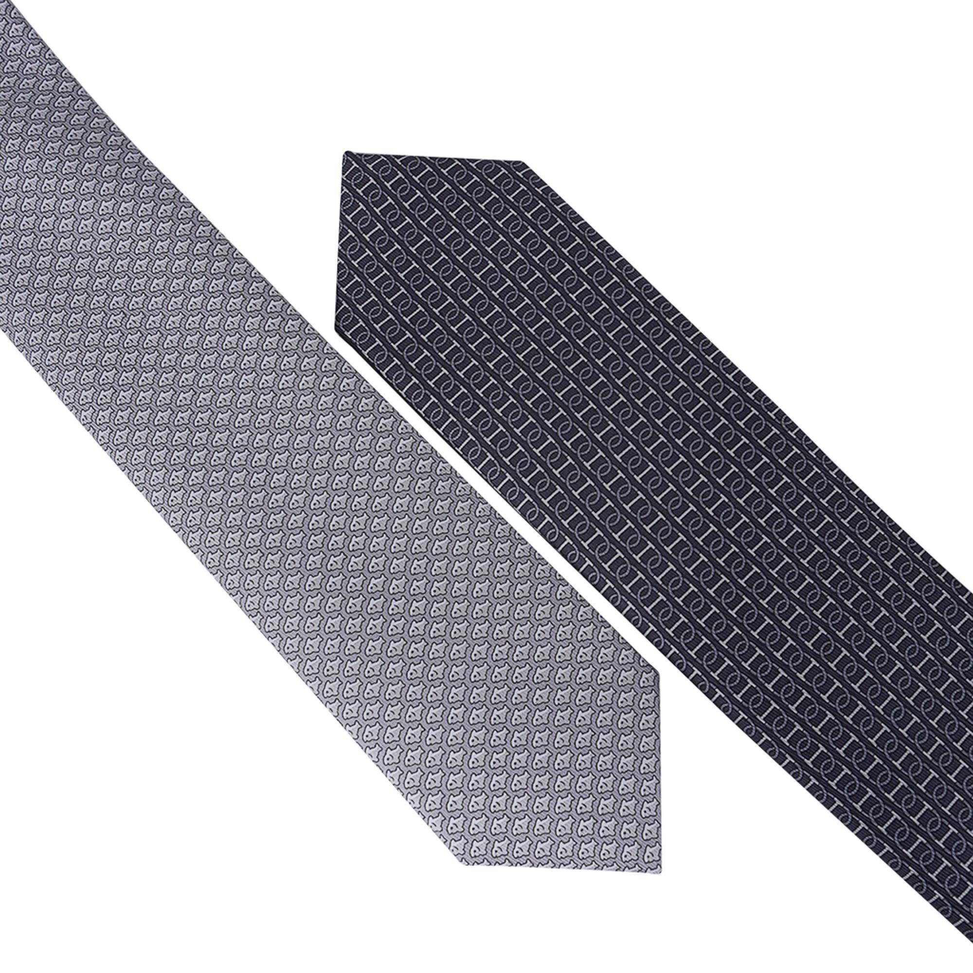Mightychic offers an Hermes Double 6 Imprimee silk twillbi tie.
Anthracite and Gris colorway.
A double tie with 2 different designs, one is classic and the other fancy.
Can be worn either way according to one's mood!
NEW or NEVER WORN.
Comes with