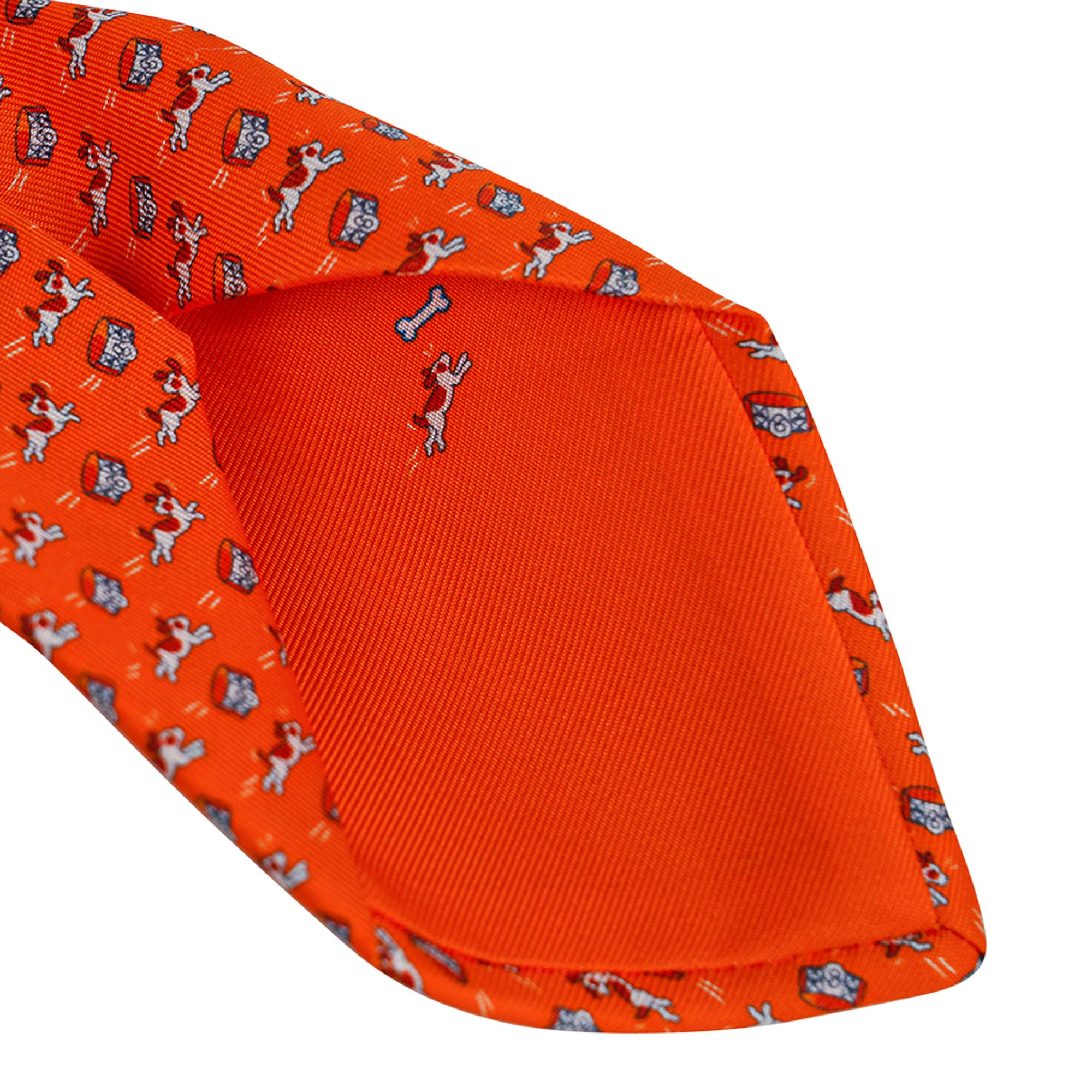 Mightychic offers an Hermes Oh My Dog Tie featured in Orange Vif, Blanc and Terracotta.
Hand-sewn silk twill.
Sweet surprise in the lining of the tie!
Designed by Philippe Mouquet.
Made in France
NEW or NEVER WORN.
final sale

TIE MEASURES:
WIDTH