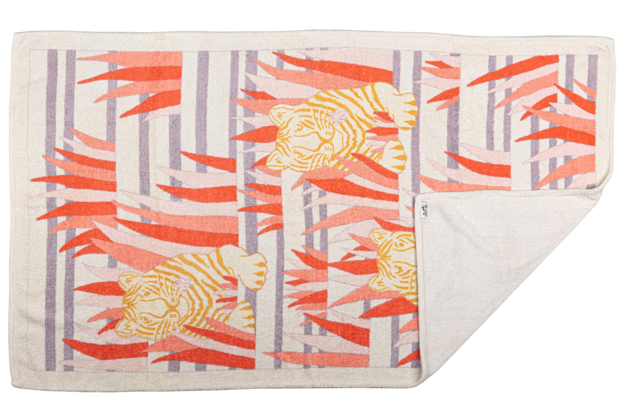 Hermès beach towel with a print of a tiger hiding behind some leaves. The piece is in excellent condition.