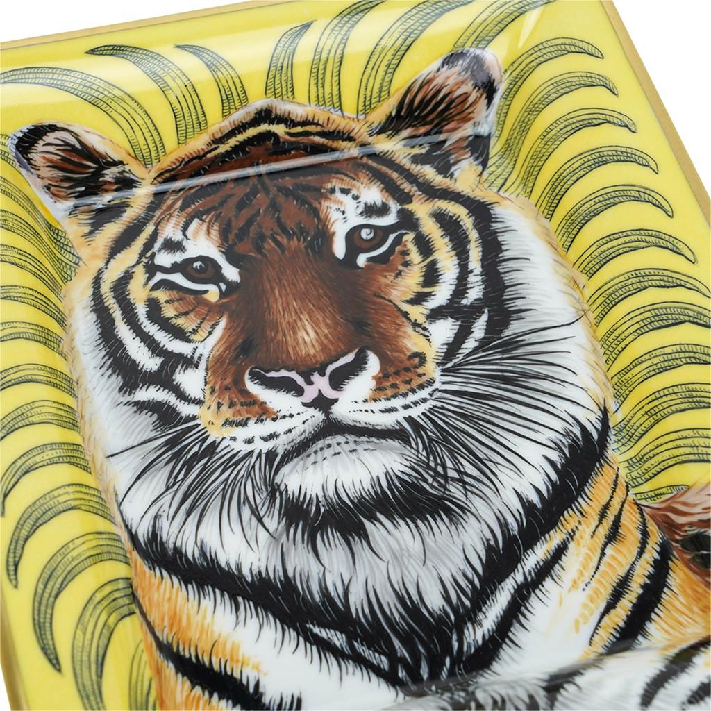 Mightychic offers an Hermes Tigre Royal Change Tray featured in Soleil.
Hand-painted porcelain with gold trim.
This magnificent regal tiger is a collectors treasure.
A decorative ashtray or tray piece perfect for any room.
Protected by velvet
