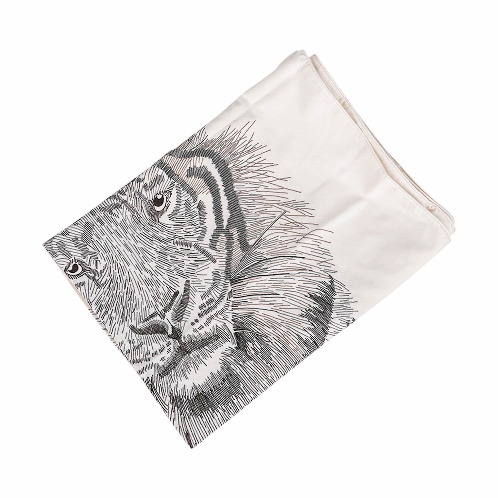 Mightychic offers a limited edition Hermes Tigre Royal stole adorned with exquisite embroidery and beads.
Meticulously crafted with over 70 hours of hand embroidery, this splendid scarf is presented in luxurious cream silk.
Designed by Christiane