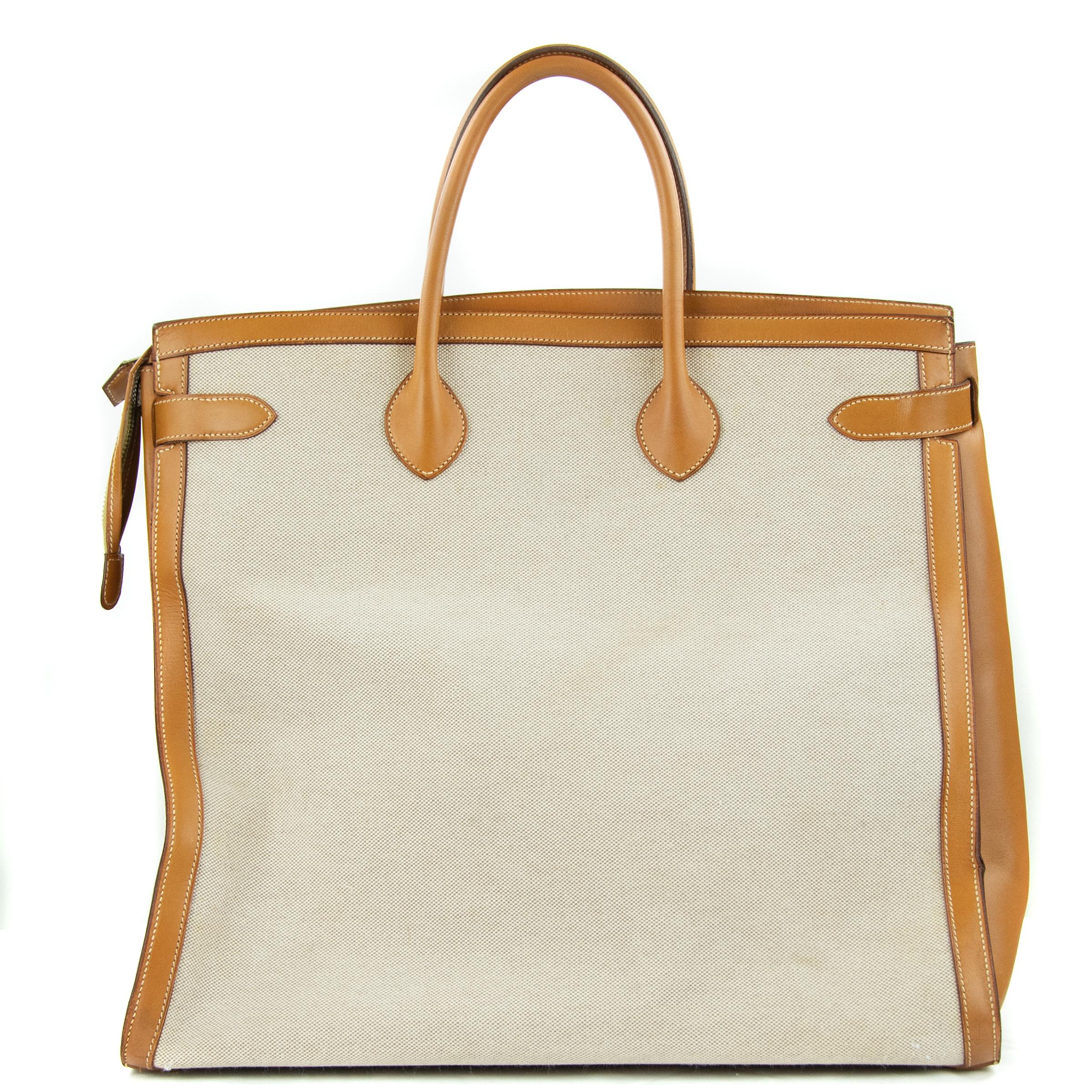 Hermes Toile & Vache Natural Weekend Bag. This iconic special order Hermes Weekend bag is timeless and chic. Fresh and crisp with gold hardware.

    Condition: New or Never used
    Made in France
    Bag Measures: 17