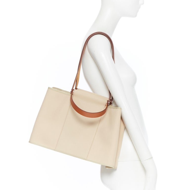 HERMES Toile H Cabag Elan Etoupe canvas tan leather expandable shoulder  tote bag at 1stDibs | hermes toile cabag, hermes cabag elan, hermes cabag  sellier