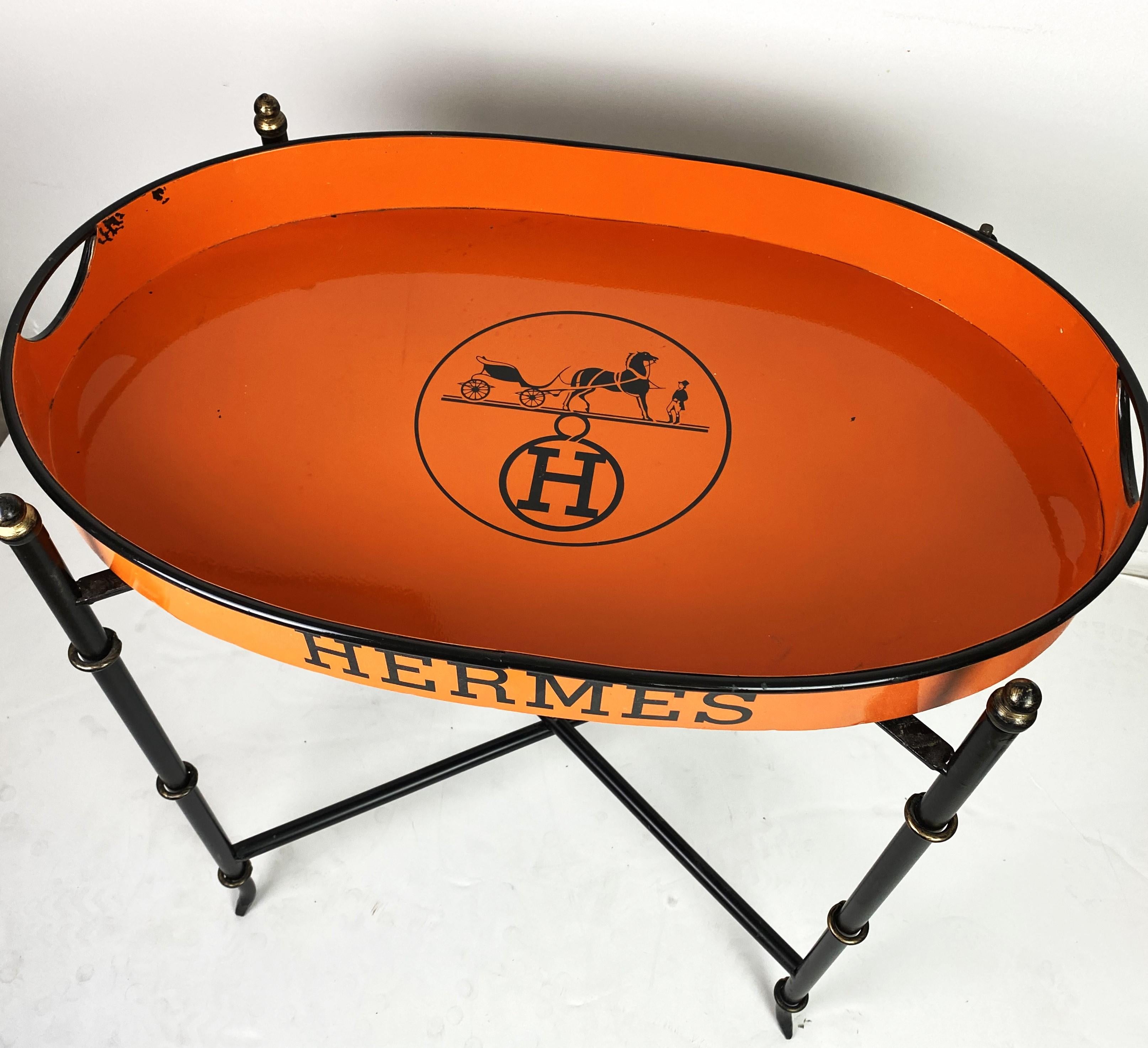 Hermes tole tray table with folding metal base. 
