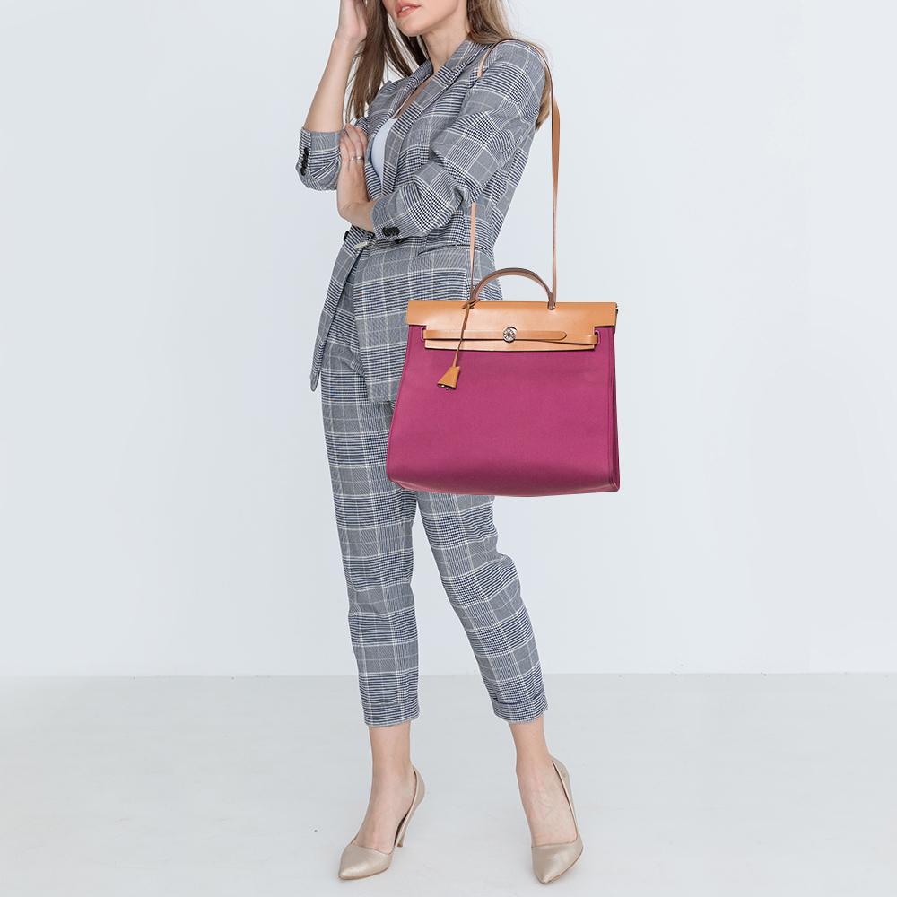 Made from canvas and leather, the Herbag Zip is just as outstanding as all of Hermes' other handbags. First introduced in 2009 as a new version of the Herbag, this piece comes with a single handle, a long shoulder strap and it flaunts a fine
