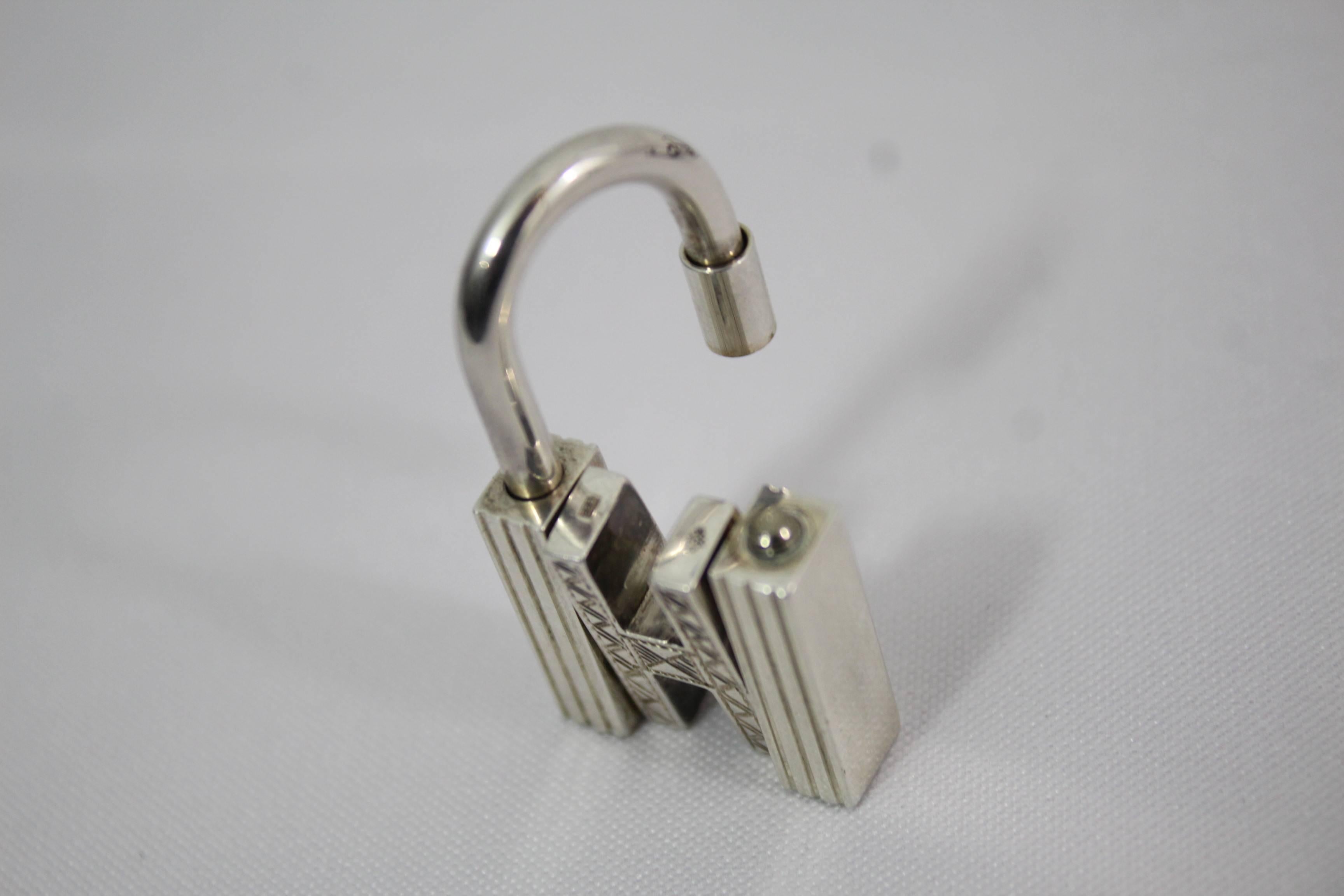 Nice hermes touareg necklace in Silver and leather feautirng the classical Hermes lock
 No longer available at hermes. 
Really good condition.
With box
