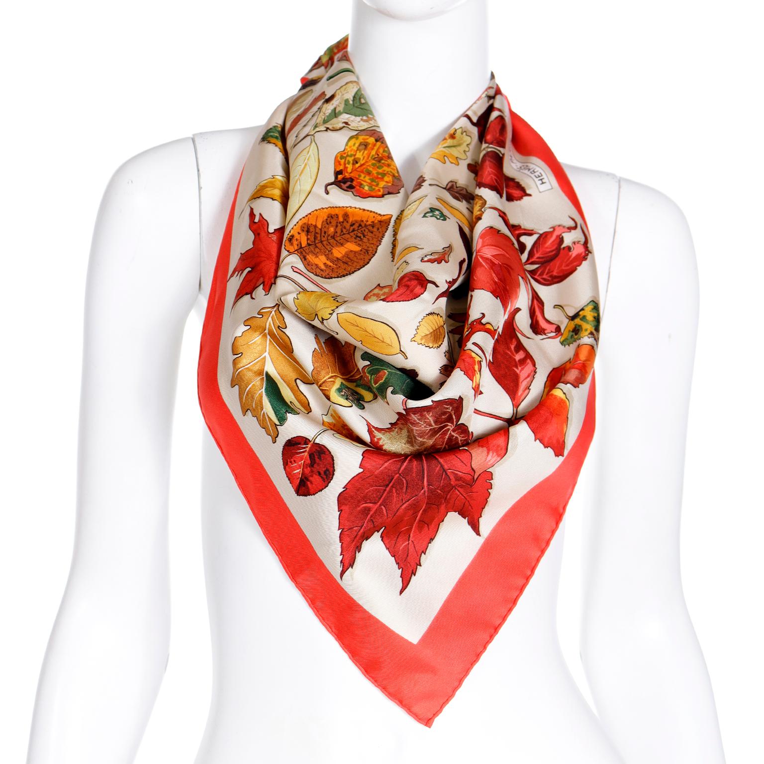 This beautiful vintage Hermès Tourbillons 100% silk scarf was designed by Christiane Vauzelles in 1968. This particular colorway is from the 1990's. The scarf has a red border and the soft cream background provides nice contrasting backdrop for the
