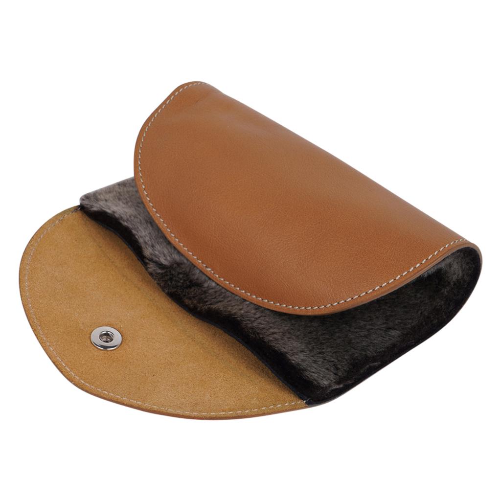 Hermes rare Travel Shoe Shine Glove in Swift leather and fur.
This fabulous shoe shine mitt is featured in gold with a palladium clou de selle snap.
Splurge for yourself - or a marvelous gift idea.
Comes with the signature Hermes box and ribbon.
New