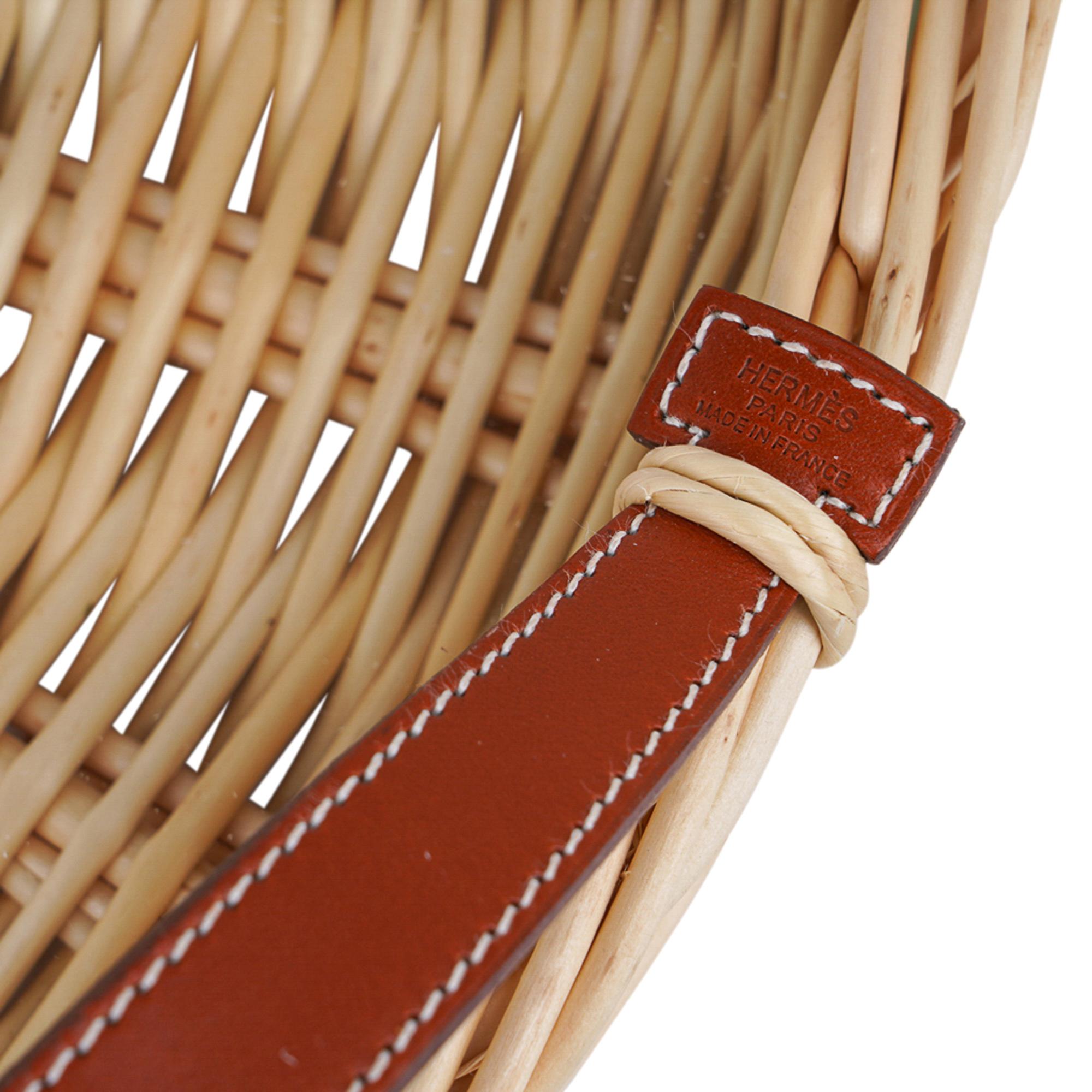 Mightychic offers an Hermes Osier (Osaeraie) Round hand woven serving tray.
Featured with Brique coloured Bridle leather handles.
Fitted glass interior to protect the wicker.
Leather has signature Hermes stamp.
Timeless piece also makes for a