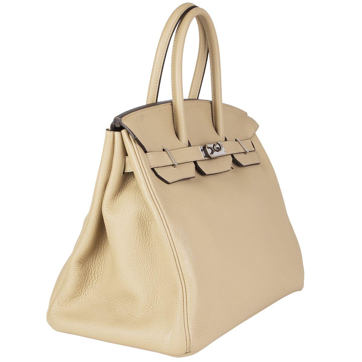Hermès 'Birkin 35' in Trench (beige) Veau Togo leather with palladium hardware. Lined in Chevre (goat skin) with an open pocket against the front and zipper pocket against the back. Has been carried and is in excellent condition. Comes with keys,