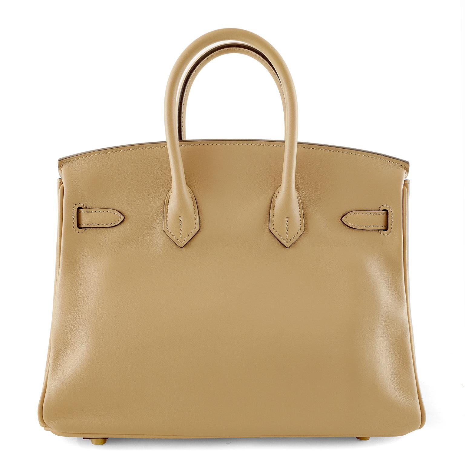 Hermès Trench Swift Leather 25 cm Birkin Bag- NEW with plastic intact on the hardware.
Waitlists exceeding a year are commonplace for the intensely coveted classic leather Birkin bag.  Each piece is hand crafted by skilled artisans and represents
