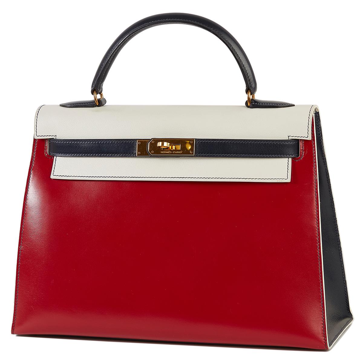 This Tri-Colour Sellier 32 cm Kelly bag from Hermès is a true testament to the quality of the house's craftsmanship, exuding timeless style and elegance, perfect for any occasion with Box Calf and Veau Graine leather and beautiful brushed palladium