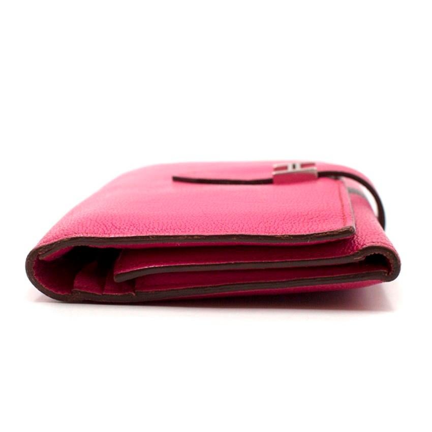 Hermes Tri-fold Bearn Wallet

- Tri-fold Bearn style wallet
- Soft leather
- Raspberry pink
- Silver-tone hardware and silver-tone foil branding
- 10 credit card slots
- 5 slip pockets
- 1 zipped change purse
- Silver-tone 'H' tab closure

Please