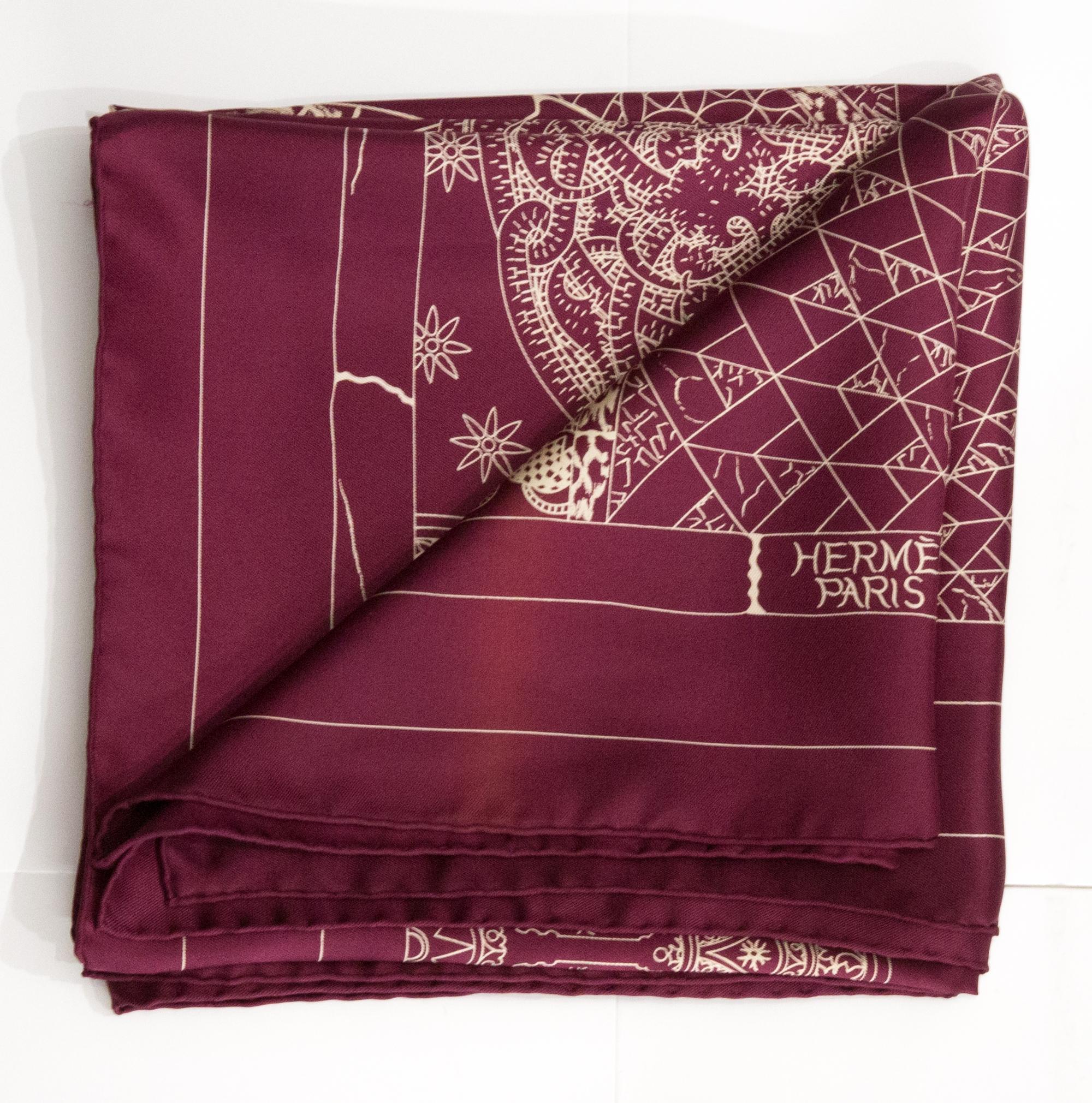 Hermès « Trophées de Venise » by Julie Abadie silk scarf featuring a bordeaux ground, a Hermès signature. 
Circa 2011
In good vintage condition. Made in France.
35,4in. (90cm)  X 35,4in. (90cm)
We guarantee you will receive this  iconic item as