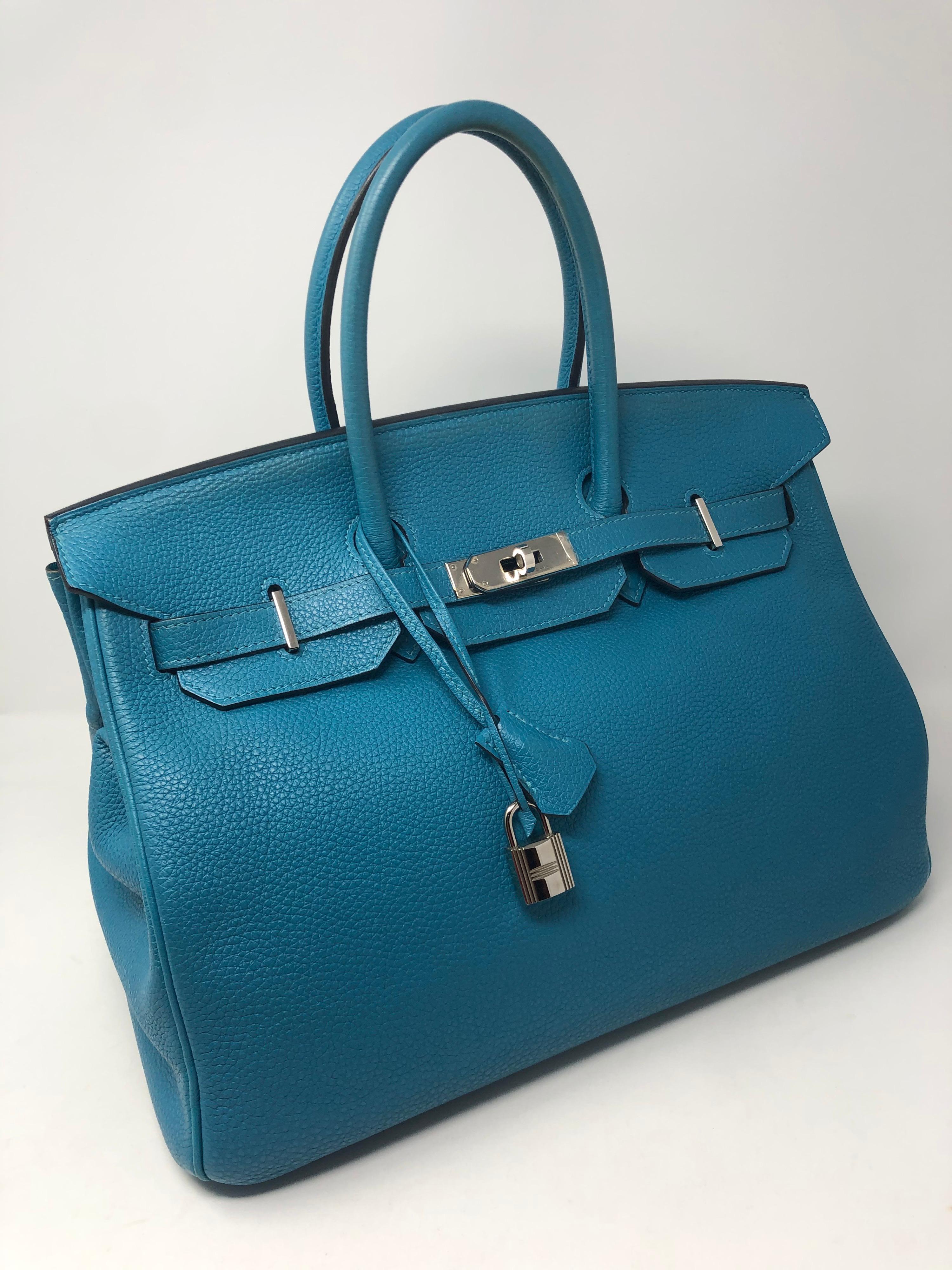 Hermes Turquoise Birkin 35. Palladium hardware. Excellent condition. Beautiful blue color. Includes dust cover, lock and keys, clochette. Guaranteed authentic. 