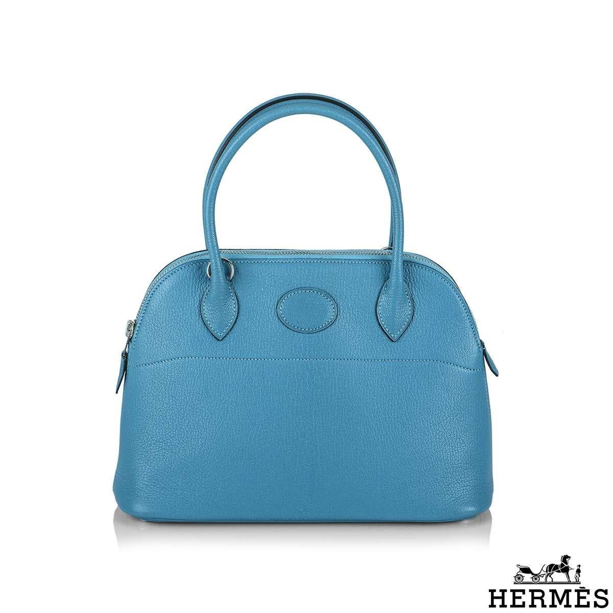 An exquisite and classic Hermès Bolide 27 bag. The exterior of this Bolide is in turquoise chevre mysore leather with tonal stitching. It features palladium hardware with two straps and front toggle closure. The interior is lined with blue lambskin