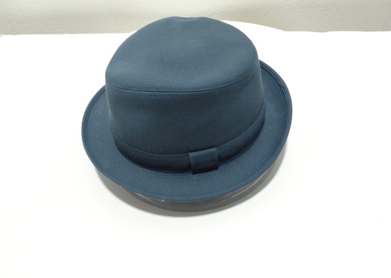 This turquoise Hermes hat with a strap is a simplistic and stylish look that shows class while still adding a pop of color. Bringing out your creative, colorful side with both feminine and masculine undertones that can be worn by any gender. The hat