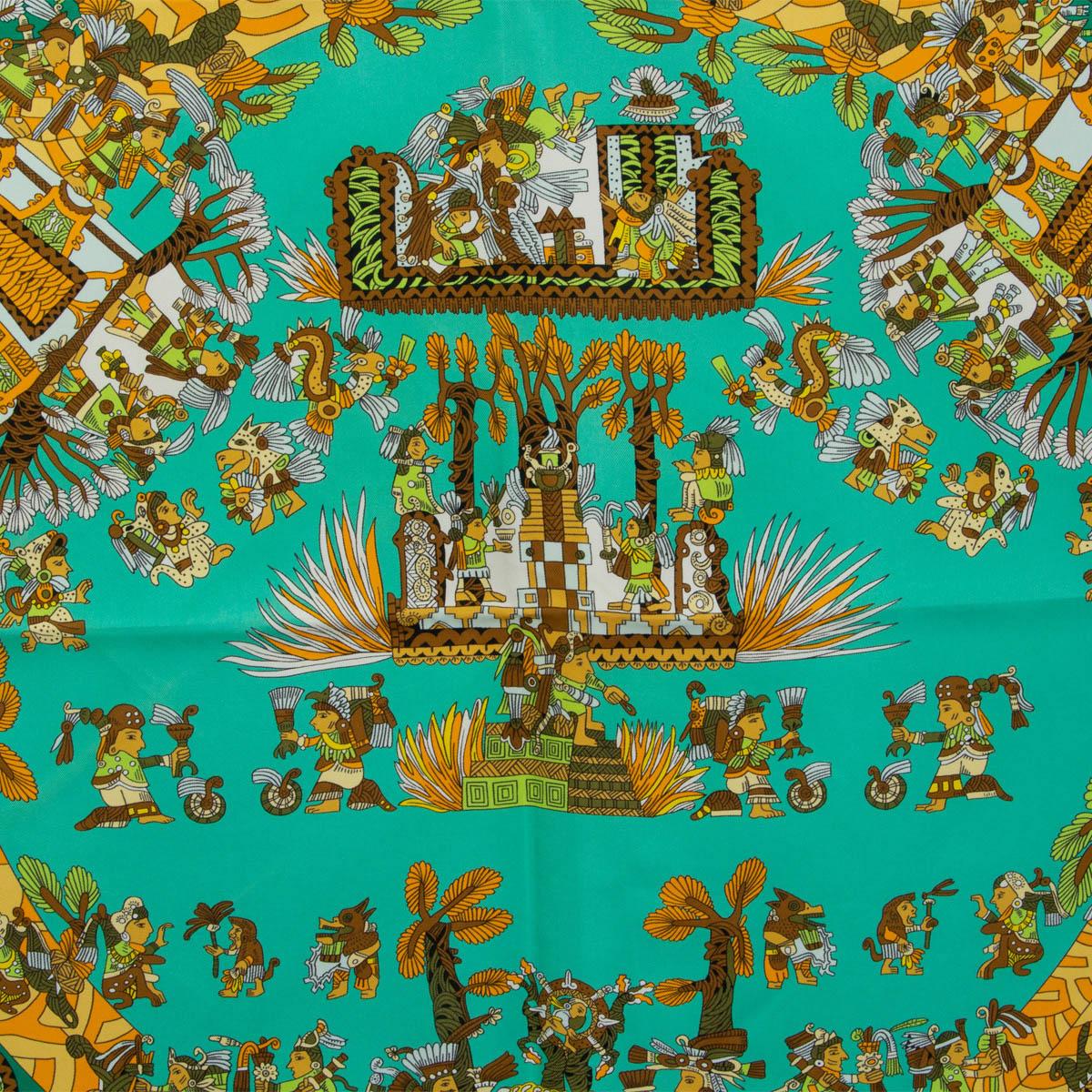 100% authentic Hermès 'Astres et Soeils 90' scarf by Annie Faivre in turquoise silk twill (100%) with contrasting dark green hem and details in green, brown, orange and gold. Has been worn and is in excellent condition.

Measurements
Width	90cm