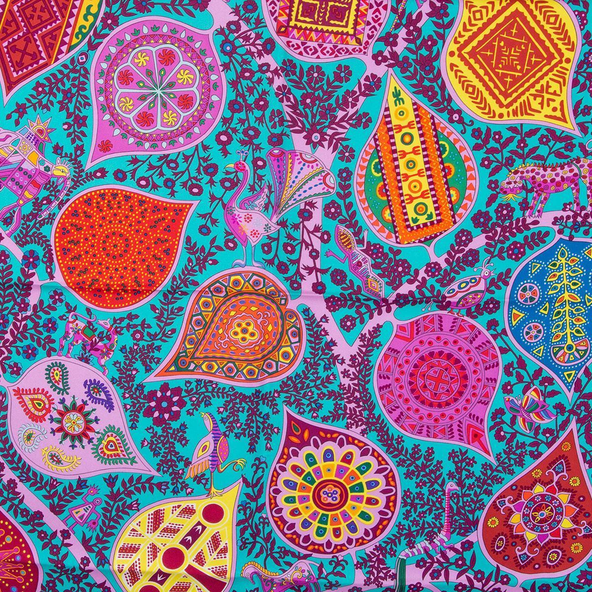 Hermes 'L'Abre de Vie 90' scarf by Christine Henry in turquoise silk twill (100%) with contasting plum hem and details in yellow, pink, orange, red and blue. Has been worn and is in excellent condition.

Width 90cm (35.1in)
Height 90cm (35.1in)