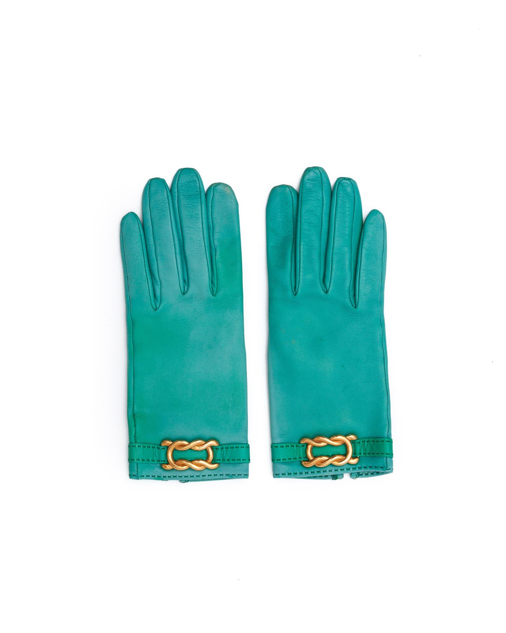Pair of turquoise gloves from Hermes, orange box included.

SIZE: Small
COLOR: Turquoise
MATERIAL: Leather
CONDITION: Good condition - some evidence of leather wear and discolouring.