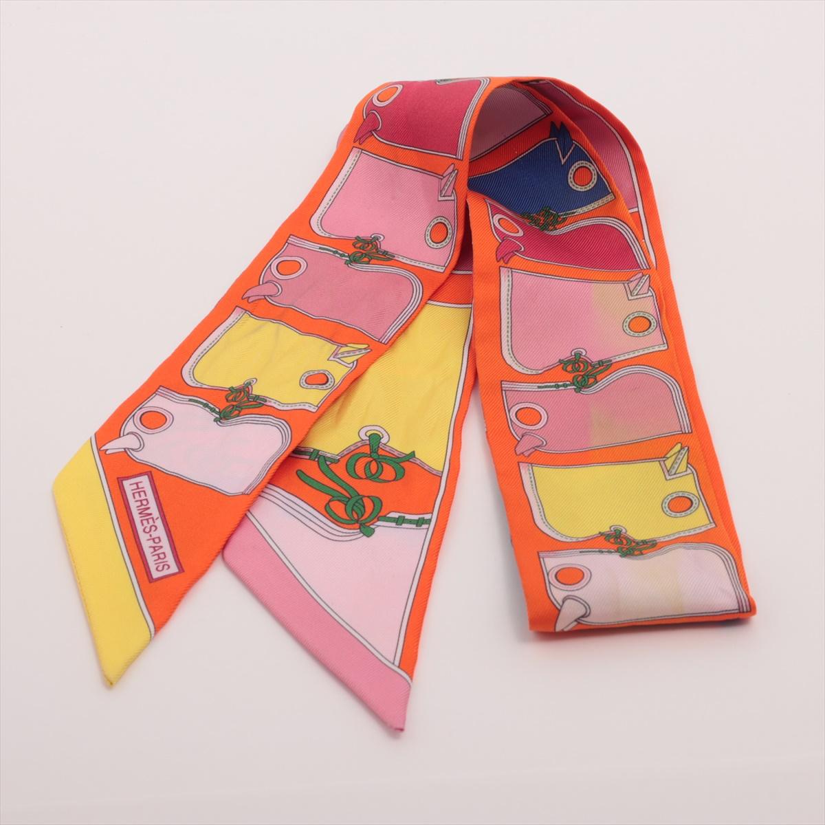 The Hermès Twilly Camails Silk in Multicolor is a refined and artistic accessory that reflects Hermès' dedication to elegance and craftsmanship. Crafted from luxurious silk, the Twilly features the Camails motif, inspired by equestrian themes and