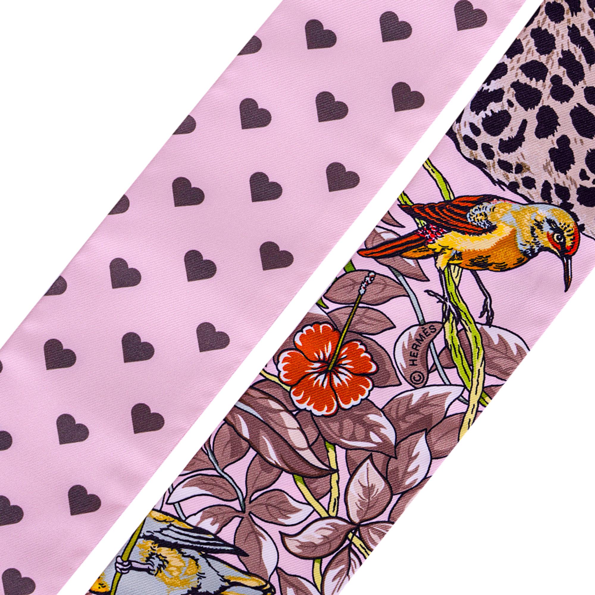 Guaranteed authentic Hermes Twilly features limited edition Jungle Love Love featured in fresh tones of Rose Pale / Etoupe.
Etoupe Hearts sprinkled against the Rose Pale background.
This iconic Hermes accessory can be worn in a myriad ways to add a