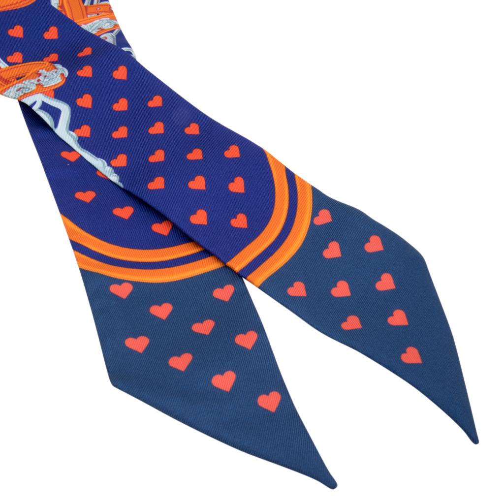 Guaranteed authentic Hermes silk scarf Twilly Love Heart Brides de Gala limited edition.
Ultra Violet, Marine and Orange creates this exquisite scarf. 
Comes with signature Hermes box and ribbon.
NEW or NEVER WORN
final sale

SIZE  32