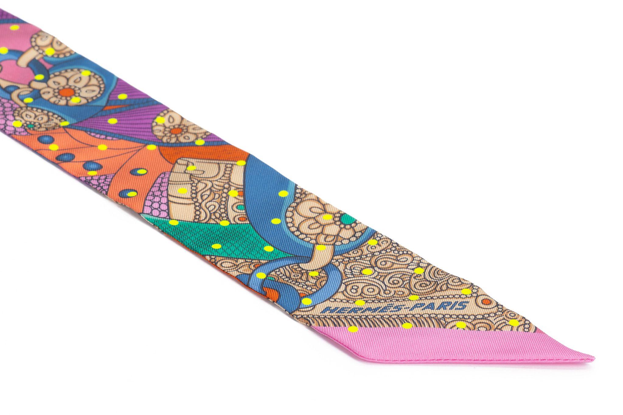 Hermès twilly in multicolor with twisted ropes pattern. The scarf is new and comes in the original box.