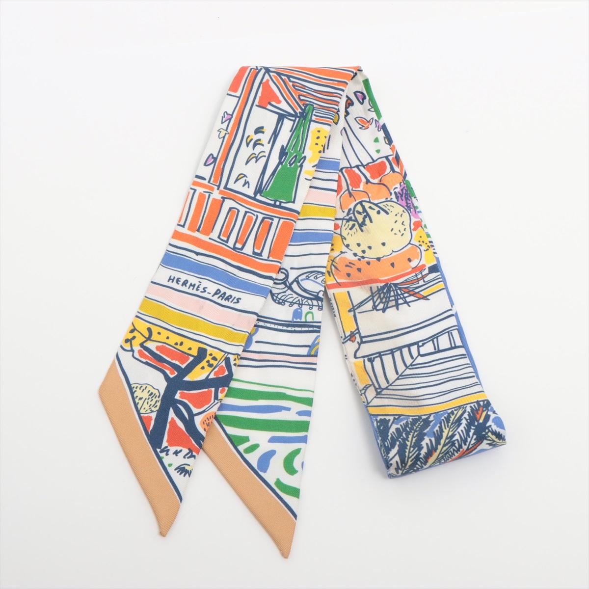 The Hermès Twilly Rayures d'Été in Silk Multicolor is a vibrant and sophisticated accessory that showcases Hermès’ exquisite craftsmanship and playful design. Featuring a lively mix of summer-inspired stripes in a range of bold and pastel hues, the