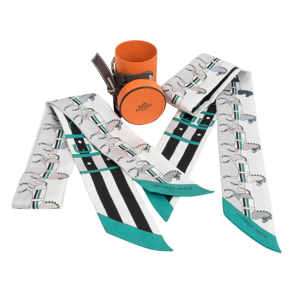 Guaranteed authentic Hermes Rocabar silk twilly set features blanc, gris perle and menthol.
Designed by Henri d'Origny. 
Comes with signature Hermes box and ribbon.
NEW or NEVER WORN
final sale

TWILLY MEASURES:
SIZE  32