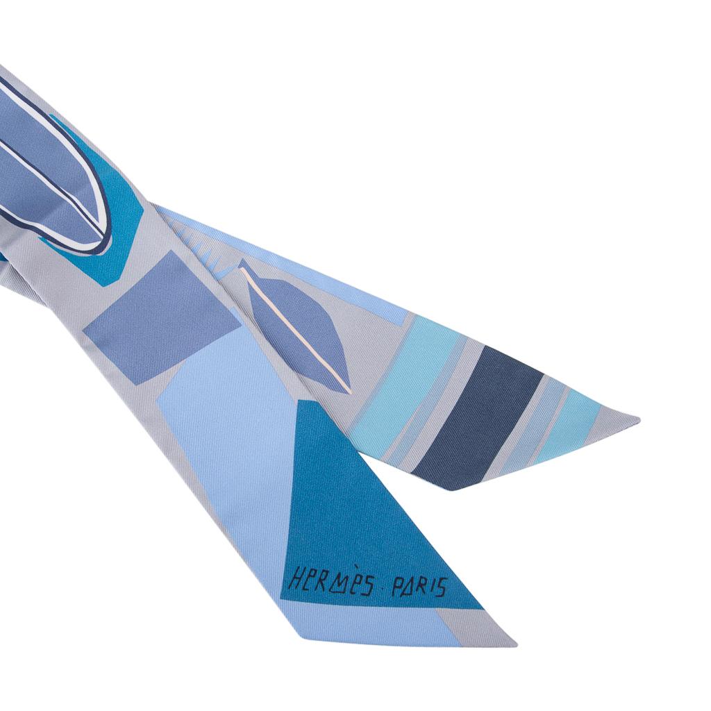 Guaranteed authentic Hermes Twilly Sea Surf and Fun by Felipe Jardim.
Features Gris, Ciel and Cobalt.
Tropical palms and surfboards.
This iconic Hermes accessory can be worn in a myriad ways to add a playful touch to your wardrobe.
And of course