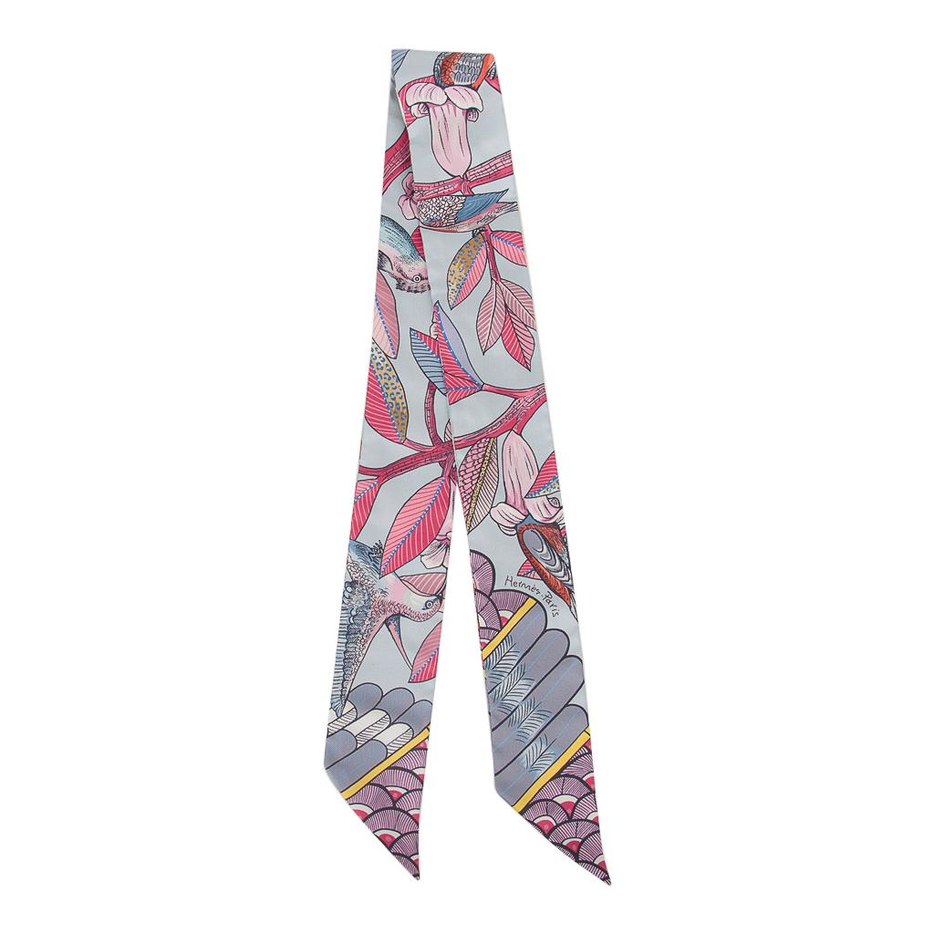 Guaranteed authentic Hermes silk twilly features Tree Of Song Blue Pale and Rose.
Designed by Ardmore Artists, this pretty palette compliments a myriad of Hermes bag colours. 
Comes with signature Hermes box and ribbon.
NEW or NEVER WORN
final
