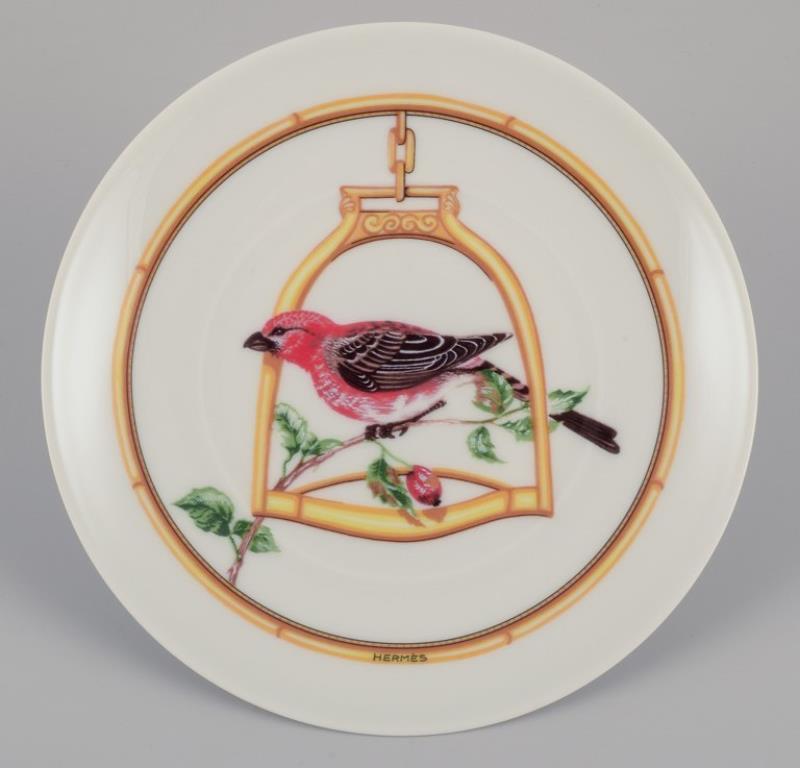 Hermès, France. Two porcelain plates with bird motifs from the 